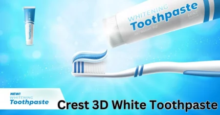 a toothbrush with a tube of toothpaste